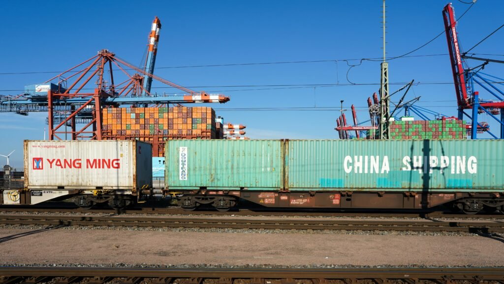 Shipping containers loaded on freight rail wagons at an intermodal terminal