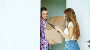 Courier handing a parcel directly to its recipient