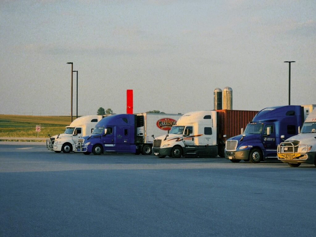 International semi trucks parked in a freight yard for general cargo road transport
