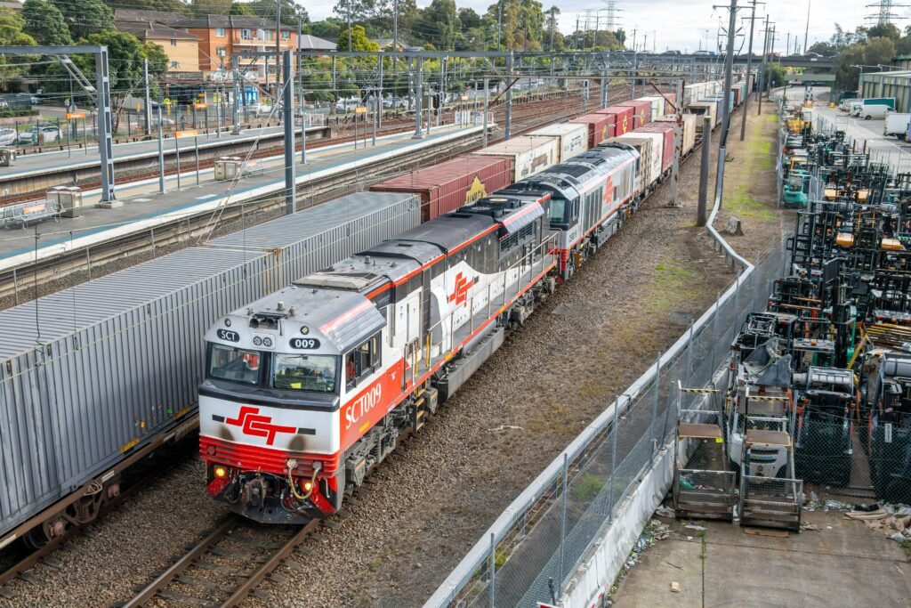 Intermodal freight train carrying containers along an international rail corridor