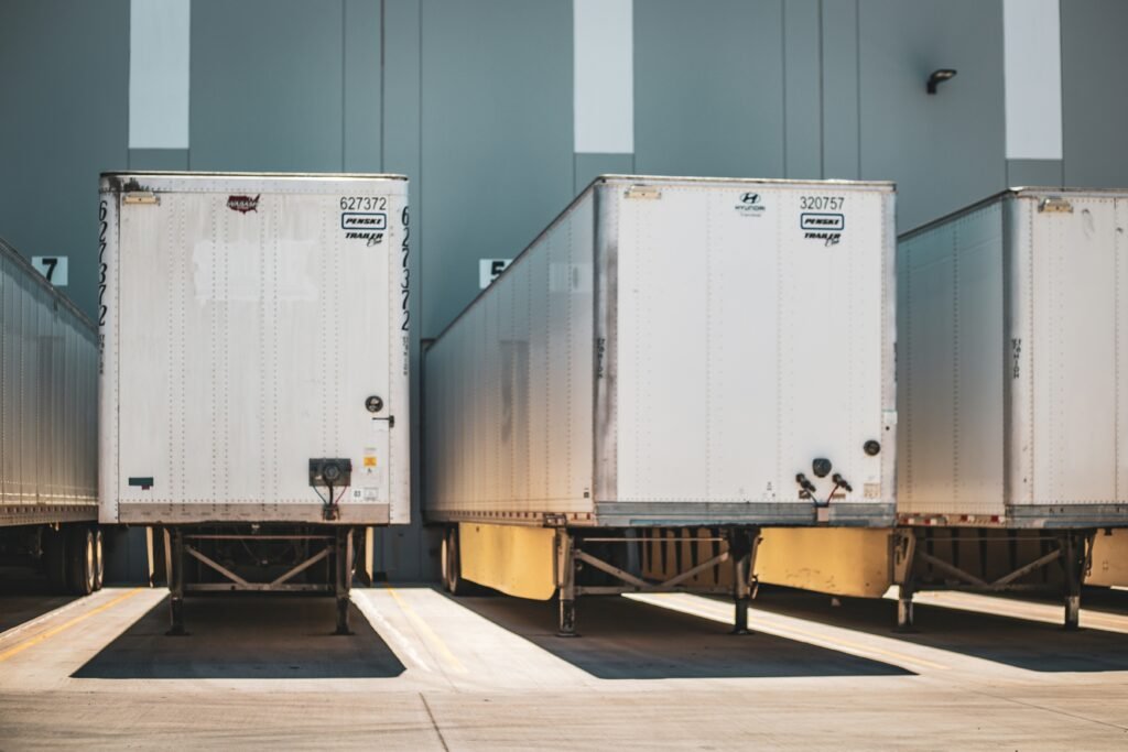 Row of professional semi trucks prepared for international freight transport